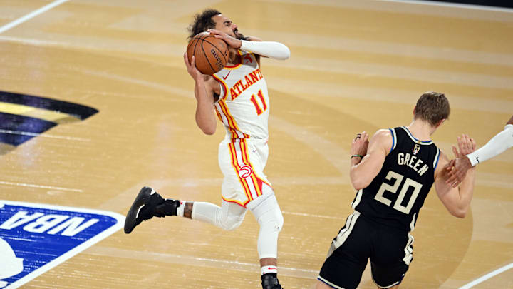 Dec 14, 2024; Las Vegas, Nevada, USA; Atlanta Hawks guard Trae Young (11) controls the ball against Milwaukee Bucks guard AJ Green (20) during the fourth quarter in a semifinal of the 2024 Emirates NBA Cup at T-Mobile Arena. Mandatory Credit: Candice Ward-Imagn Images Dec 14, 2024; Las Vegas, Nevada, USA; Atlanta Hawks guard Trae Young (11) controls the ball against Milwaukee Bucks guard AJ Green (20) during the fourth quarter in a semifinal of the 2024 Emirates NBA Cup at T-Mobile Arena. Mandatory Credit: Candice Ward-Imagn Images