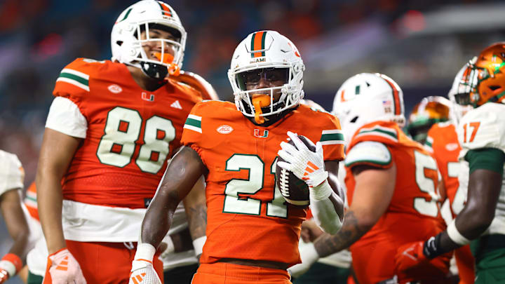 Sep 7, 2024; Miami Gardens, Florida, USA; Miami Hurricanes running back Jordan Lyle (21) reacts after running with the football against the Florida A&M Rattlers during the third quarter at Hard Rock Stadium. Mandatory Credit: Sam Navarro-Imagn Images Sep 7, 2024; Miami Gardens, Florida, USA; Miami Hurricanes running back Jordan Lyle (21) reacts after running with the football against the Florida A&M Rattlers during the third quarter at Hard Rock Stadium. Mandatory Credit: Sam Navarro-Imagn Images