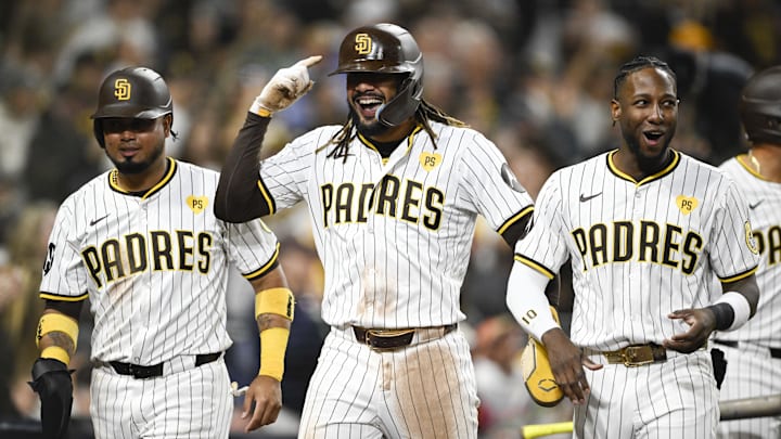 Jun 6, 2024; San Diego, California, USA; San Diego Padres right fielder Fernando Tatis Jr. (23), center, Luis Arraez (4), left, and Jurickson Profar (10) celebrate after Tatis scored during the fifth inning against the Arizona Diamondbacks at Petco Park. Mandatory Credit: Denis Poroy-Imagn Images at Petco Park. Jun 6, 2024; San Diego, California, USA; San Diego Padres right fielder Fernando Tatis Jr. (23), center, Luis Arraez (4), left, and Jurickson Profar (10) celebrate after Tatis scored during the fifth inning against the Arizona Diamondbacks at Petco Park. Mandatory Credit: Denis Poroy-Imagn Images at Petco Park.