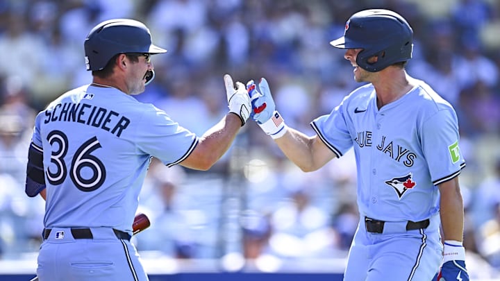 Aug 10, 2025; Los Angeles, California, USA; Toronto Blue Jays second baseman Ernie Clement (22) celebrates with outfielder Davis Schneider (36) after hitting a solo home run against the Los Angeles Dodgers during the ninth inning at Dodger Stadium. Aug 10, 2025; Los Angeles, California, USA; Toronto Blue Jays second baseman Ernie Clement (22) celebrates with outfielder Davis Schneider (36) after hitting a solo home run against the Los Angeles Dodgers during the ninth inning at Dodger Stadium.