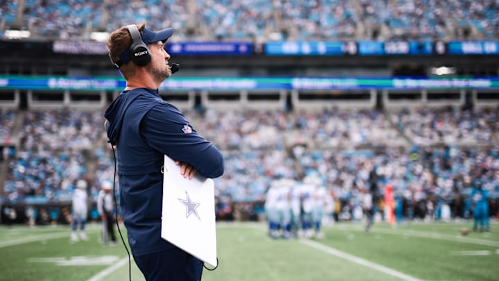 Dallas Cowboys head coach Brian Schottenheimer looks on from the sideline during the first quarter against the Carolina Panthers