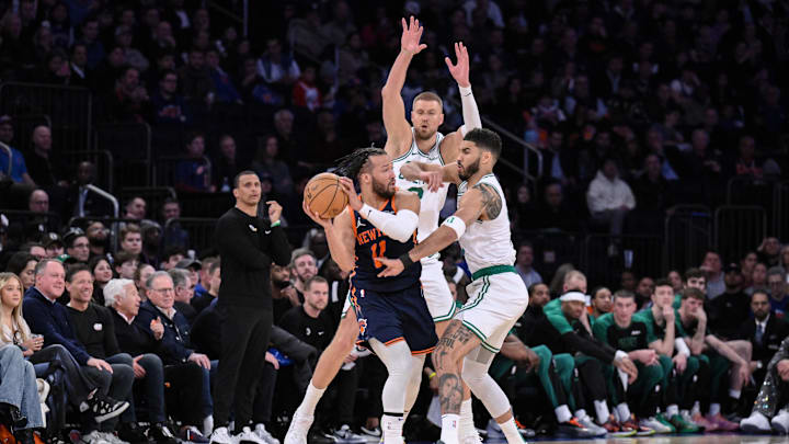Apr 8, 2025; New York, New York, USA; New York Knicks guard Jalen Brunson (11) looks to pass the ball as Boston Celtics center Kristaps Porzingis (8) and forward Jayson Tatum (0) defend during the second half at Madison Square Garden. Mandatory Credit: John Jones-Imagn Images Apr 8, 2025; New York, New York, USA; New York Knicks guard Jalen Brunson (11) looks to pass the ball as Boston Celtics center Kristaps Porzingis (8) and forward Jayson Tatum (0) defend during the second half at Madison Square Garden. Mandatory Credit: John Jones-Imagn Images