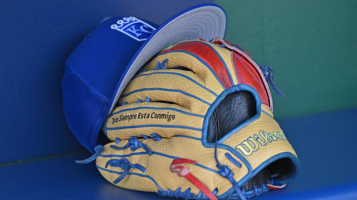 Aug 12, 2023; Kansas City, Missouri, USA;  Detailed view of a Kansas City Royals hat and glove before a game  against the St. Louis Cardinals at Kauffman Stadium. Mandatory Credit: Peter Aiken-Imagn Images