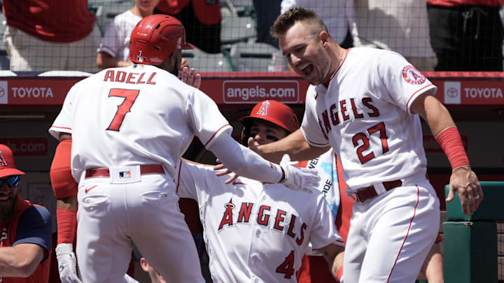 Apr 24, 2022; Anaheim, California, USA; Los Angeles Angels left fielder Jo Adell (7) celebrates with center fielder Mike Trout (27) after hitting a grand slam home run in the first inning against the Baltimore Orioles at Angel Stadium. Mandatory Credit: Kirby Lee-Imagn Images