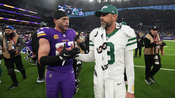 Oct 6, 2024; London, United Kingdom; New York Jets quarterback Aaron Rodgers (8) shakes hands with Minnesota Vikings safety Harrison Smith (22) after the game atTottenham Hotspur Stadium.