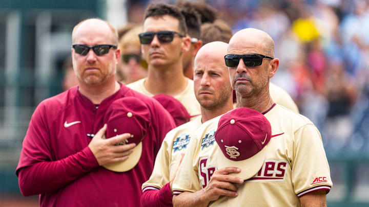 Jun 18, 2024; Omaha, NE, USA; Florida State Seminoles head coach Link Jarrett during the national anthem before the game against the North Carolina Tar Heels at Charles Schwab Field Omaha. Mandatory Credit: Dylan Widger-Imagn Images