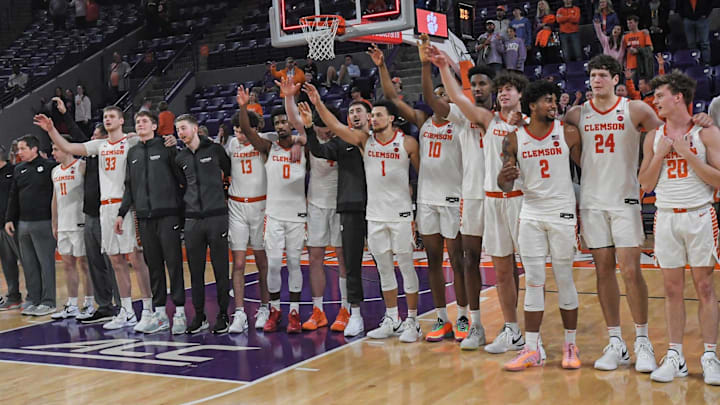 Dec 22, 2023; Clemson, South Carolina, USA; Clemson basketball team joins in the alma mater after the game with Queens University the game against Queens University at Littlejohn Coliseum. Mandatory Credit: Ken Ruinard-Imagn Images