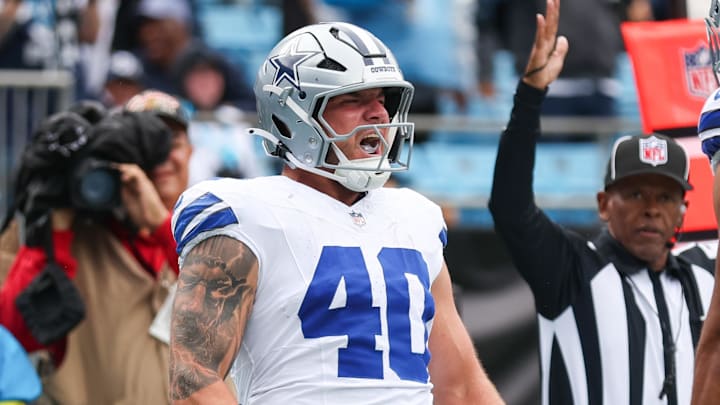 Dallas Cowboys running back Hunter Luepke celebrates a touchdown against the Carolina Panthers at Bank of America Stadium. Dallas Cowboys running back Hunter Luepke celebrates a touchdown against the Carolina Panthers at Bank of America Stadium.