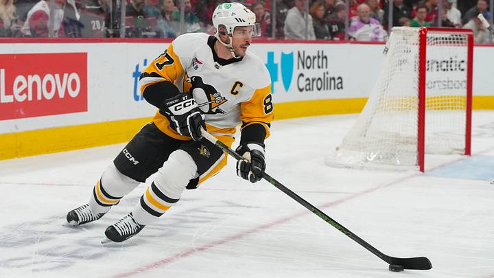 Mar 18, 2026; Raleigh, North Carolina, USA;  Pittsburgh Penguins center Sidney Crosby (87) skates with the puck against the Carolina Hurricanes during the first period at Lenovo Center. Mandatory Credit: James Guillory-Imagn Images