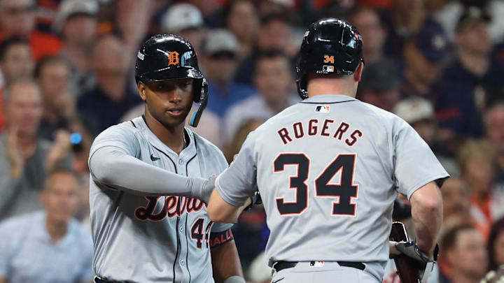 Oct 1, 2024; Houston, Texas, USA; Detroit Tigers catcher Jake Rogers (34) celebrates with outfielder Justyn-Henry Malloy (44) after scoring a run against the Houston Astros in the second inning in game one of the Wild Card round for the 2024 MLB Playoffs at Minute Maid Park.