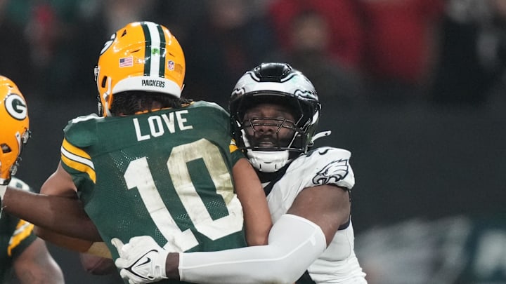 Green Bay Packers quarterback Jordan Love (10) is pressured by Philadelphia Eagles defensive end Josh Sweat.