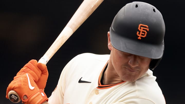 Apr 26, 2026; San Francisco, California, USA; San Francisco Giants third baseman Matt Chapman (26) is hit by a pitch from Miami Marlins starting pitcher Max Meyer during the third inning at Oracle Park. Mandatory Credit: D. Ross Cameron-Imagn Images