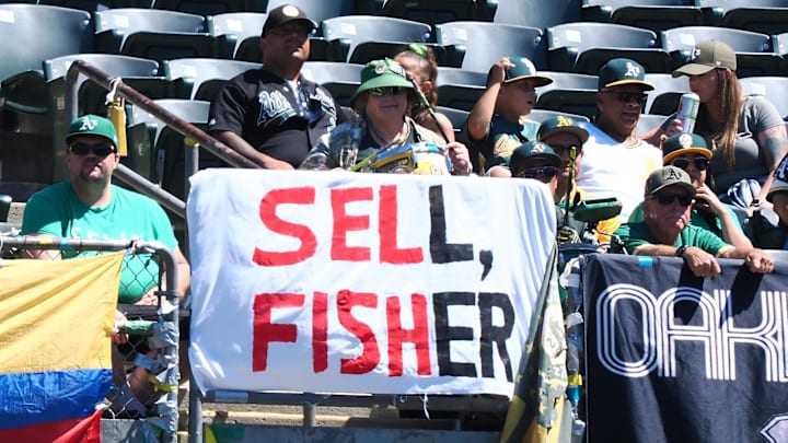 Sep 4, 2023; Oakland, California, USA; A sign reading  sell, Fisher  displayed along the outfield