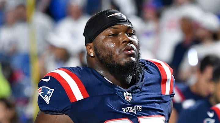 New England Patriots defensive end Milton Williams (97) leaves the field.