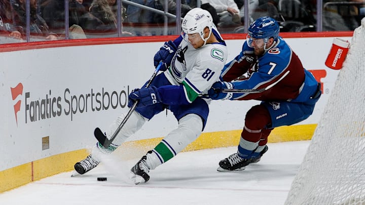 Apr 10, 2025; Denver, Colorado, USA; Vancouver Canucks center Dakota Joshua (81) and Colorado Avalanche defenseman Devon Toews (7) battle for the puck in the third period at Ball Arena. Mandatory Credit: Isaiah J. Downing-Imagn Images Apr 10, 2025; Denver, Colorado, USA; Vancouver Canucks center Dakota Joshua (81) and Colorado Avalanche defenseman Devon Toews (7) battle for the puck in the third period at Ball Arena. Mandatory Credit: Isaiah J. Downing-Imagn Images