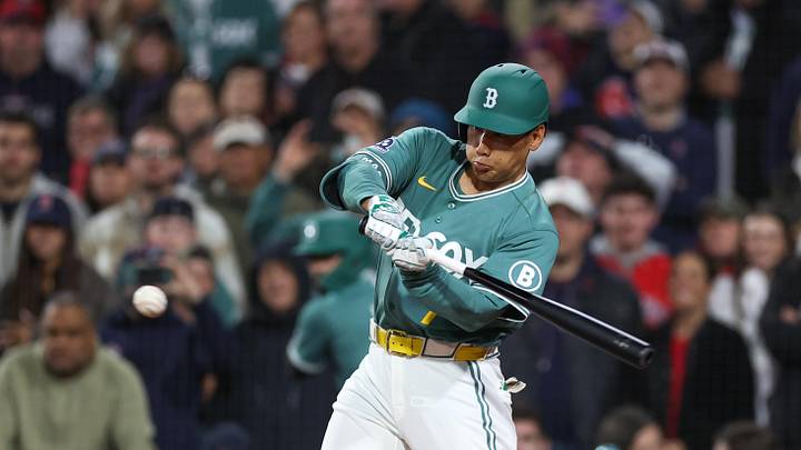 Apr 17, 2026; Boston, Massachusetts, USA; Boston Red Sox pinch hitter Masataka Yoshida (7) hits an RBI during the tenth inning against the Detroit Tigers at Fenway Park. Mandatory Credit: Paul Rutherford-Imagn Images