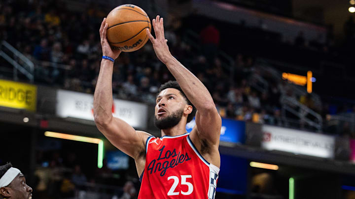 Feb 23, 2025; Indianapolis, Indiana, USA;  LA Clippers guard Ben Simmons (25) shoots the ball while Indiana Pacers forward Pascal Siakam (43) defends in the first half at Gainbridge Fieldhouse. Mandatory Credit: Trevor Ruszkowski-Imagn Images