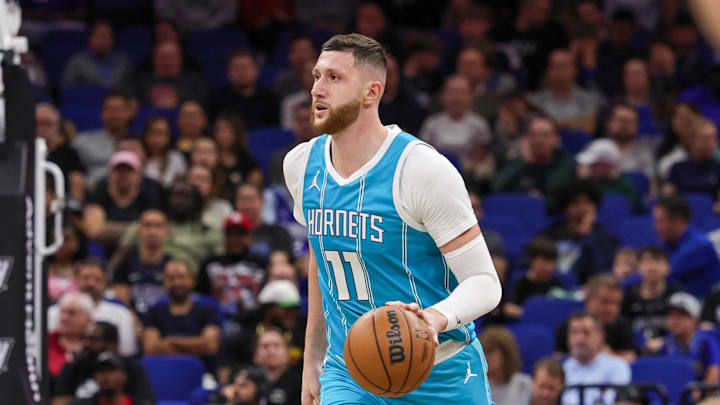 Feb 12, 2025; Orlando, Florida, USA; Charlotte Hornets center Jusuf Nurkic (11) brings the ball up court during the second quarter against the Orlando Magic at Kia Center. Mandatory Credit: Mike Watters-Imagn Images
