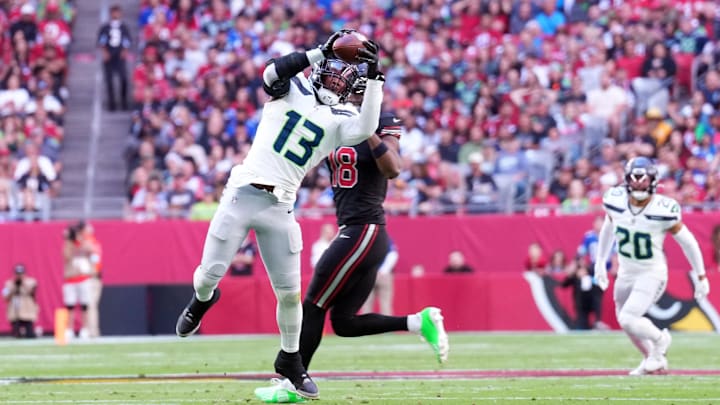 Dec 8, 2024; Glendale, Arizona, USA; Seattle Seahawks linebacker Ernest Jones IV (13) intercepts a pass against the Arizona Cardinals during the first half at State Farm Stadium. Mandatory Credit: Joe Camporeale-Imagn Images