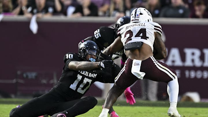 Oct 4, 2025; College Station, Texas, USA; Texas A&M Aggies defensive end Marco Jones (10) tackles Mississippi State Bulldogs running back Fluff Bothwell (24) during the first quarter at Kyle Field. Mandatory Credit: Maria Lysaker-Imagn Images 