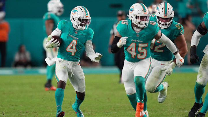 Miami Dolphins cornerback Kader Kohou (4) runs with the ball after intercepting a pass from San Francisco 49ers quarterback Brock Purdy during second half at Hard Rock Stadium.