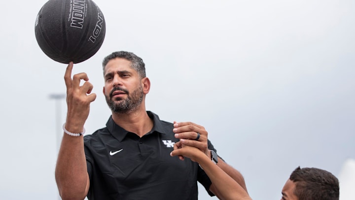University of Kentucky assistant men's basketball coach Orlando Antigua helped Gage Durrett, 9, spin a basketball on his finger while visiting Pillar's Crestwood Station day program. June 8, 2021
Aj4t3915 University of Kentucky assistant men's basketball coach Orlando Antigua helped Gage Durrett, 9, spin a basketball on his finger while visiting Pillar's Crestwood Station day program. June 8, 2021
Aj4t3915