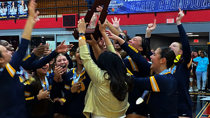 St. Thomas Aquinas players and coaches celebrate after winning the 2024 Class 6A girls volleyball state championship on Saturday at Polk State College in Winter Haven. St. Thomas Aquinas players and coaches celebrate after winning the 2024 Class 6A girls volleyball state championship on Saturday at Polk State College in Winter Haven.