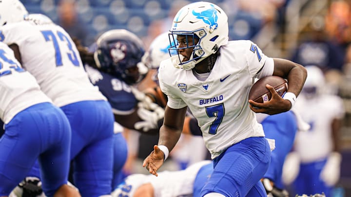 Sep 28, 2024; East Hartford, Connecticut, USA; Buffalo Bulls quarterback C.J. Ogbonna (7) runs the ball against the Connecticut Huskies in the first quarter at Rentschler Field at Pratt & Whitney Stadium. Mandatory Credit: David Butler II-Imagn Images