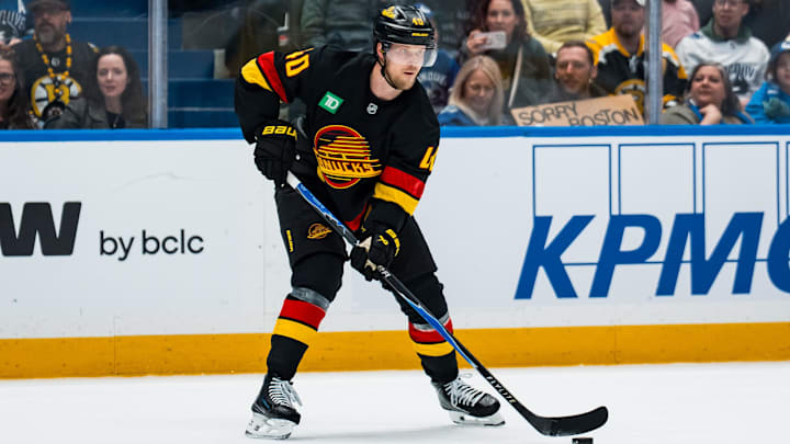 Jan 3, 2026; Vancouver, British Columbia, CAN; Vancouver Canucks forward Elias Pettersson (40) handles the puck against the Boston Bruins in the second period at Rogers Arena. Mandatory Credit: Bob Frid-Imagn Images