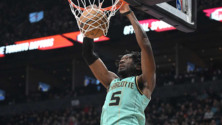 Mar 28, 2025; Toronto, Ontario, CAN;  Charlotte Hornets center Mark Williams (5) dunks for a basket against the Toronto Raptors in the second half at Scotiabank Arena. Mandatory Credit: Dan Hamilton-Imagn Images
