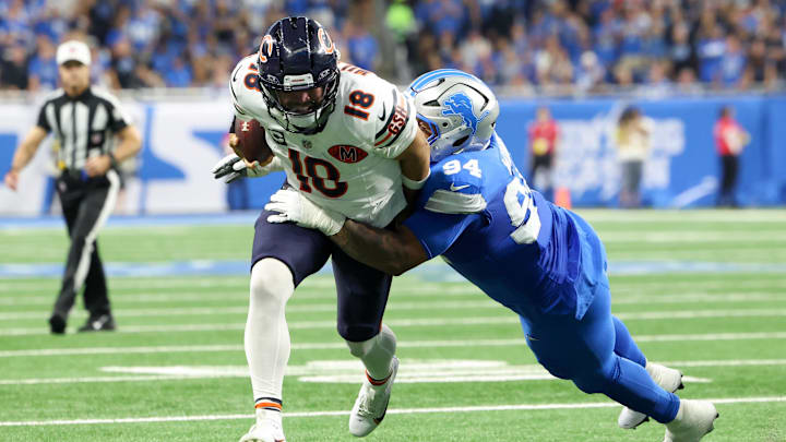 Sep 14, 2025; Detroit, Michigan, USA; Detroit Lions defensive tackle Mekhi Wingo (94) tackles Chicago Bears quarterback Caleb Williams (18) during the second quarter of the game at Ford Field. Mandatory Credit: David Reginek-Imagn Images