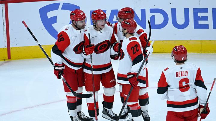 Oct 10, 2026; Chicago, Illinois, USA;  Carolina Hurricanes right wing Jackson Blake (53) celebrates with teammates after he scored a goal against the Chicago Blackhawks during the second period at the United Center.  Mandatory Credit: Matt Marton-Imagn Images