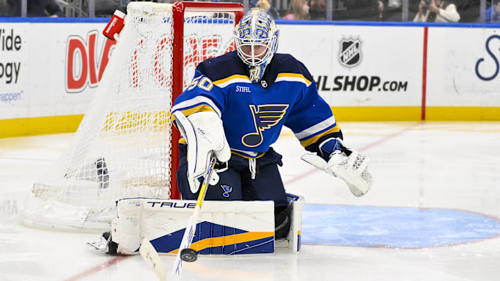 Feb 23, 2025; St. Louis, Missouri, USA;  St. Louis Blues goaltender Jordan Binnington (50) defends the net against the Colorado Avalanche during the third period at Enterprise Center. Mandatory Credit: Jeff Curry-Imagn Images