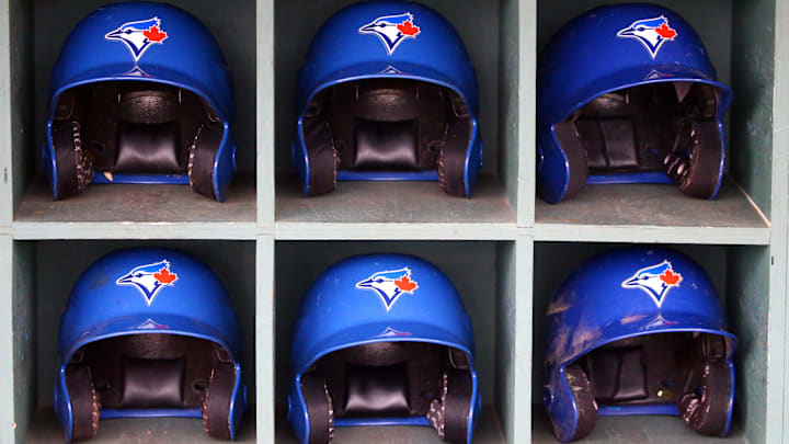 Mar 20, 2018; Clearwater, FL, USA; Toronto Blue Jays helmets sit in the dugout before the start of a Spring Training baseball game against the Philadelphia Phillies at Spectrum Field Mar 20, 2018; Clearwater, FL, USA; Toronto Blue Jays helmets sit in the dugout before the start of a Spring Training baseball game against the Philadelphia Phillies at Spectrum Field