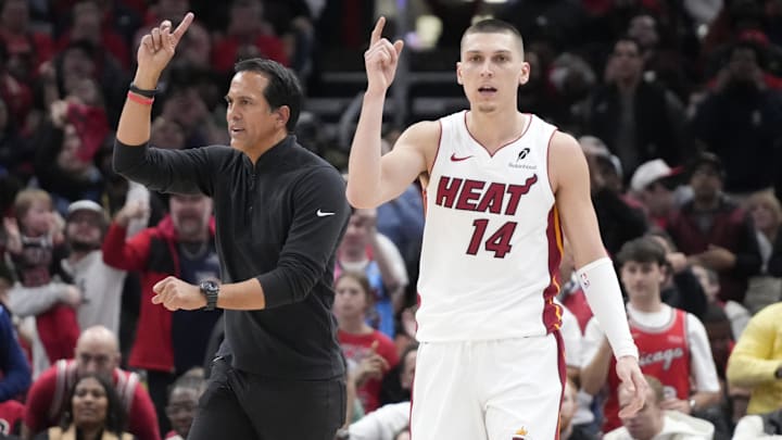 Apr 16, 2025; Chicago, Illinois, USA; Miami Heat guard Tyler Herro (14) and head coach Erik Spoelstra ask for a replay against the Chicago Bulls during the second half at United Center. Mandatory Credit: David Banks-Imagn Images