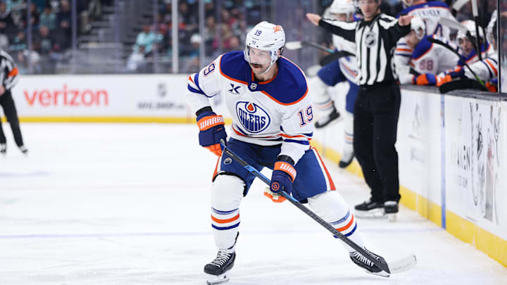 Nov 29, 2025; Seattle, Washington, USA; Edmonton Oilers center Adam Henrique (19) looks to pass in the second period against the Seattle Kraken at Climate Pledge Arena. Mandatory Credit: Kevin Ng-Imagn Images Nov 29, 2025; Seattle, Washington, USA; Edmonton Oilers center Adam Henrique (19) looks to pass in the second period against the Seattle Kraken at Climate Pledge Arena. Mandatory Credit: Kevin Ng-Imagn Images