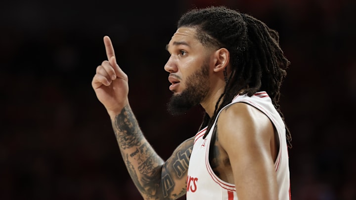 Feb 21, 2026; Houston, Texas, USA;  Houston Cougars guard Emanuel Sharp (21) reacts while playing against the Arizona Wildcats in the first half at Fertitta Center. 