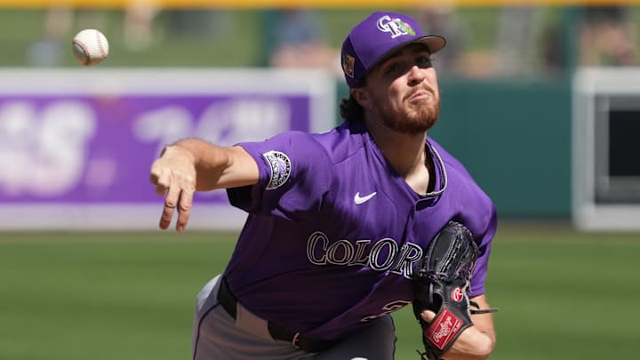 Colorado Rockies pitcher Chase Dollander (32) throws in spring training. Colorado Rockies pitcher Chase Dollander (32) throws in spring training.