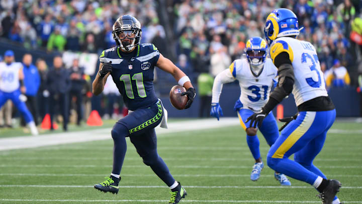 Jan 25, 2026; Seattle, WA, USA; Seattle Seahawks wide receiver Jaxon Smith-Njigba (11) runs after a catch against the Los Angeles Rams in the first half in the 2026 NFC Championship Game at Lumen Field. Mandatory Credit: Steven Bisig-Imagn Images