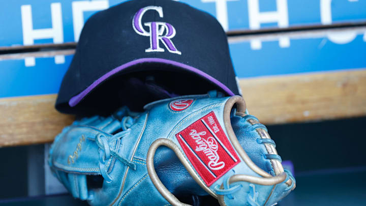 Colorado Rockies cap and glove in the dugout during the game against the Detroit Tigers at Comerica Park in Detorit on April 23, 2022. Colorado Rockies cap and glove in the dugout during the game against the Detroit Tigers at Comerica Park in Detorit on April 23, 2022.