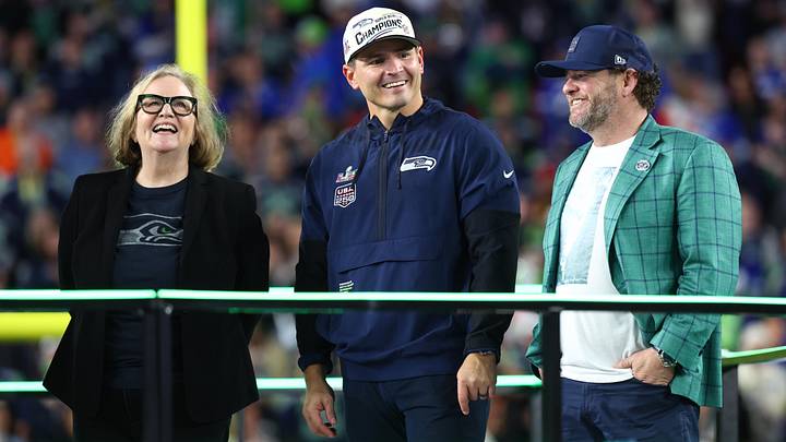 Seattle Seahawks chairman Jody Allen, head coach Mike MacDonald, and general manager John Schneider on the podium. Seattle Seahawks chairman Jody Allen, head coach Mike MacDonald, and general manager John Schneider on the podium.