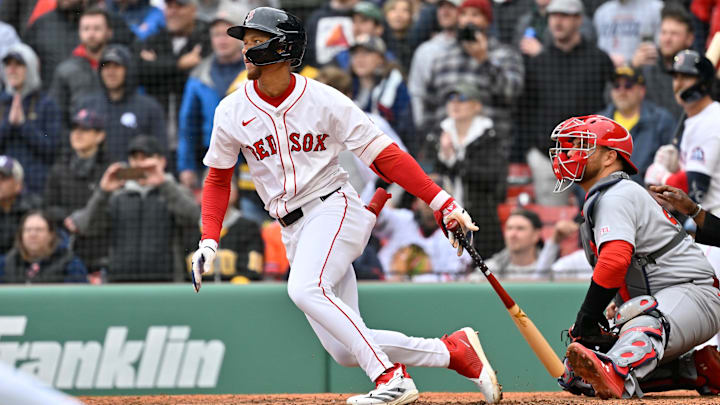 Boston, Massachusetts, USA; Boston Red Sox center fielder Kristian Campbell (28) hits an RBI single during the ninth inning against the St. Louis Cardinals at Fenway Park.