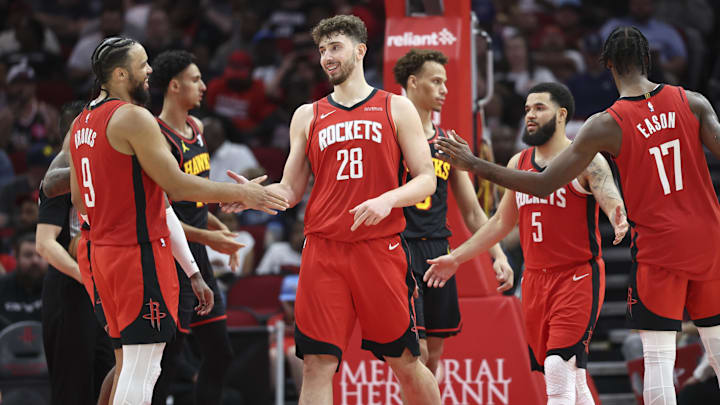 Mar 25, 2025; Houston, Texas, USA; Houston Rockets center Alperen Sengun (28) celebrates with forward Dillon Brooks (9) after scoring a basket during the third quarter against the Atlanta Hawks at Toyota Center. Mandatory Credit: Troy Taormina-Imagn Images