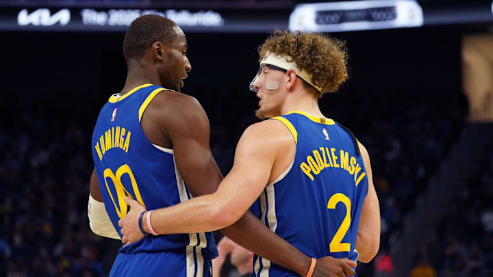 Oct 30, 2024; San Francisco, California, USA; Golden State Warriors forward Jonathan Kuminga (00) huddles with guard Brandin Podziemski (2) during the game against New Orleans Pelicans during the fourth quarter at Chase Center. Mandatory Credit: David Gonzales-Imagn Images