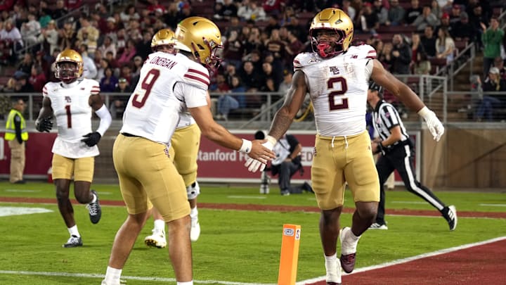 Sep 13, 2025; Stanford, California, USA; Boston College Eagles running back Turbo Richard (2) is congratulated by quarterback Dylan Lonergan (9) after catching a touchdown pass against the Stanford Cardinal during the second quarter at Stanford Stadium. Mandatory Credit: Darren Yamashita-Imagn Images Sep 13, 2025; Stanford, California, USA; Boston College Eagles running back Turbo Richard (2) is congratulated by quarterback Dylan Lonergan (9) after catching a touchdown pass against the Stanford Cardinal during the second quarter at Stanford Stadium. Mandatory Credit: Darren Yamashita-Imagn Images