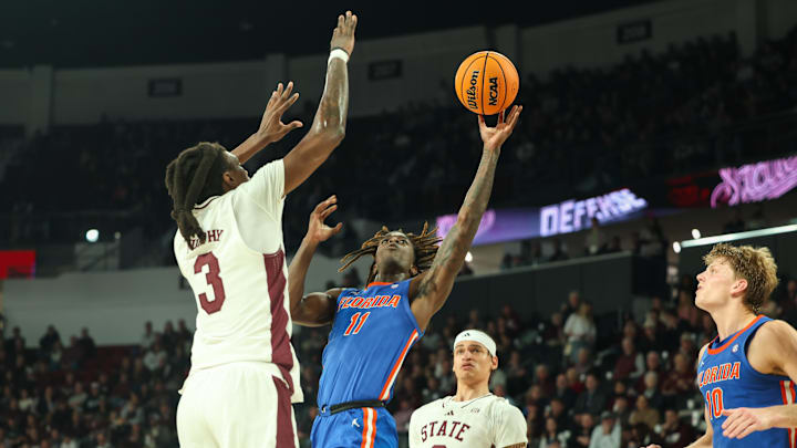Feb 11, 2025; Starkville, Mississippi, USA; Florida Gators guard Denzel Aberdeen (11) shoots against Mississippi State Bulldogs forward KeShawn Murphy (3) during the first half at Humphrey Coliseum. Mandatory Credit: Wesley Hale-Imagn Images Feb 11, 2025; Starkville, Mississippi, USA; Florida Gators guard Denzel Aberdeen (11) shoots against Mississippi State Bulldogs forward KeShawn Murphy (3) during the first half at Humphrey Coliseum. Mandatory Credit: Wesley Hale-Imagn Images