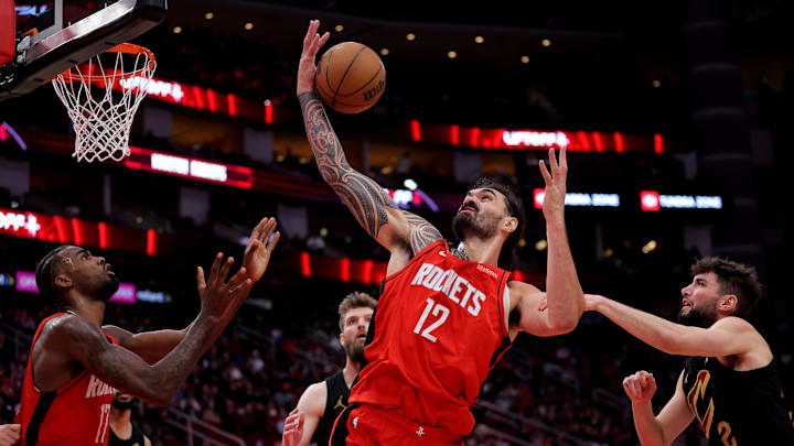 Jan 22, 2025; Houston, Texas, USA; Houston Rockets center Steven Adams (12) rebounds against the Cleveland Cavaliers during the fourth quarter at Toyota Center. Mandatory Credit: Erik Williams-Imagn Images