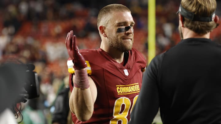 Dec 29, 2024; Landover, Maryland, USA; Washington Commanders tight end Zach Ertz (86) celebrates while leaving the field after defeating the Atlanta Falcons at Northwest Stadium. Mandatory Credit: Amber Searls-Imagn Images