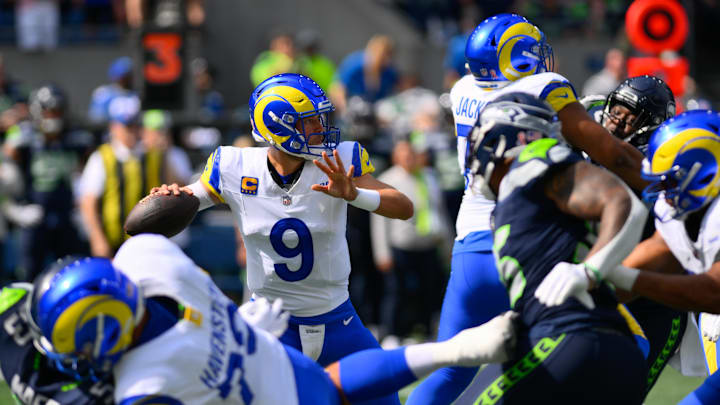 Sep 10, 2023; Seattle, Washington, USA; Los Angeles Rams quarterback Matthew Stafford (9) passes the ball against the Seattle Seahawks during the first half at Lumen Field. Mandatory Credit: Steven Bisig-Imagn Images