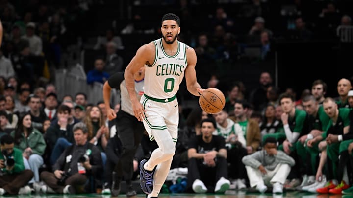 Apr 11, 2025; Boston, Massachusetts, USA; Boston Celtics forward Jayson Tatum (0) dribbles the ball against the Charlotte Hornets during the first half at TD Garden. Mandatory Credit: Eric Canha-Imagn Images
